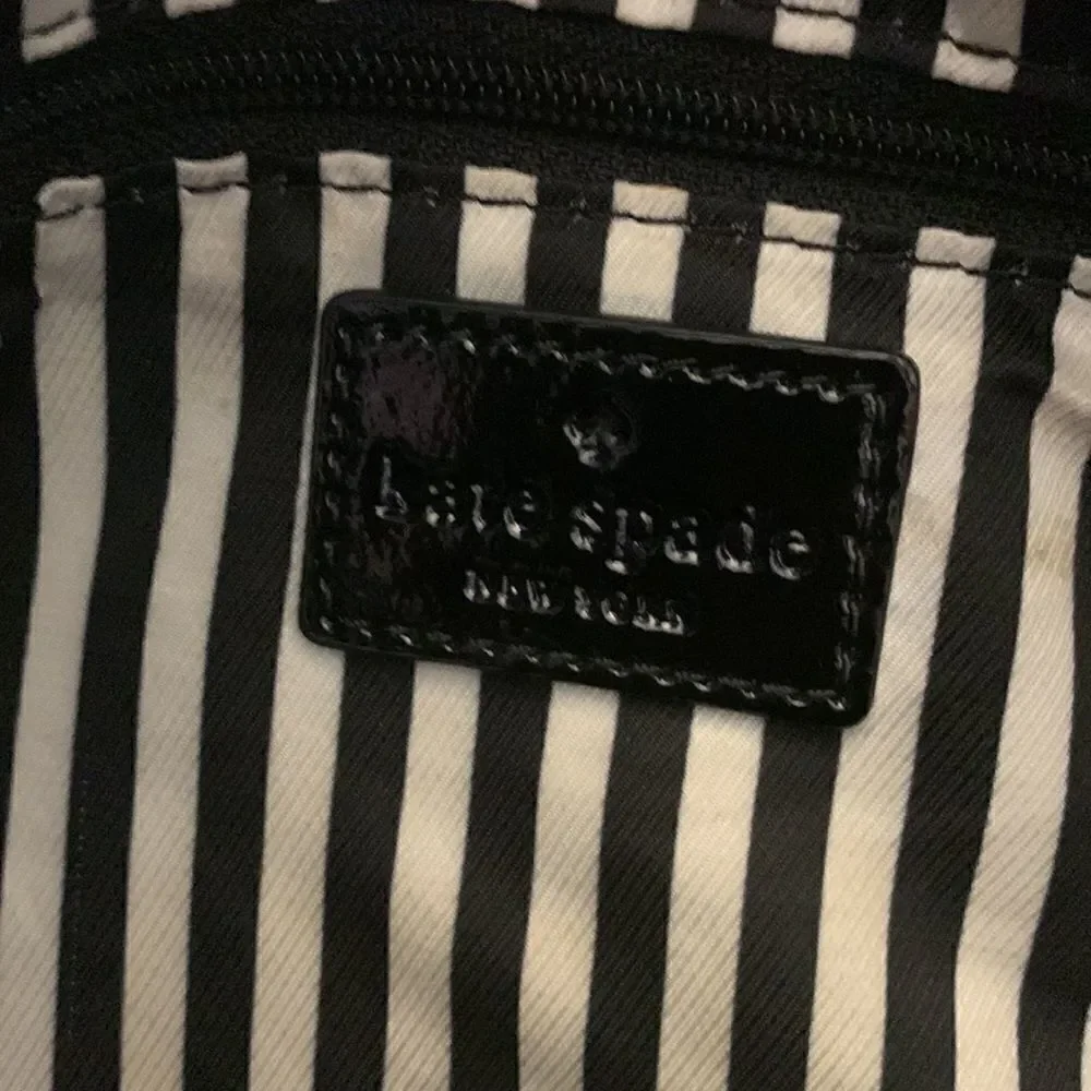 Kate Spade black leather tote bag with exterior and interior pockets
